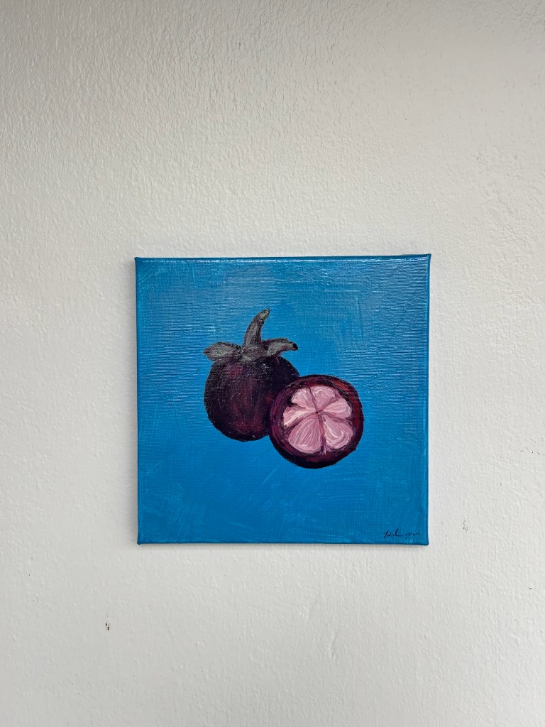 Mangosteen fruit on a bright blue background